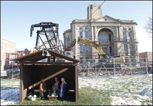 A nativity scene still stands outside the Seneca County Courthouse in Tiffin. The county commissioners are paying B&B Wrecking and Excavating of Cleveland $373,000 to demolish the 1884 courthouse.