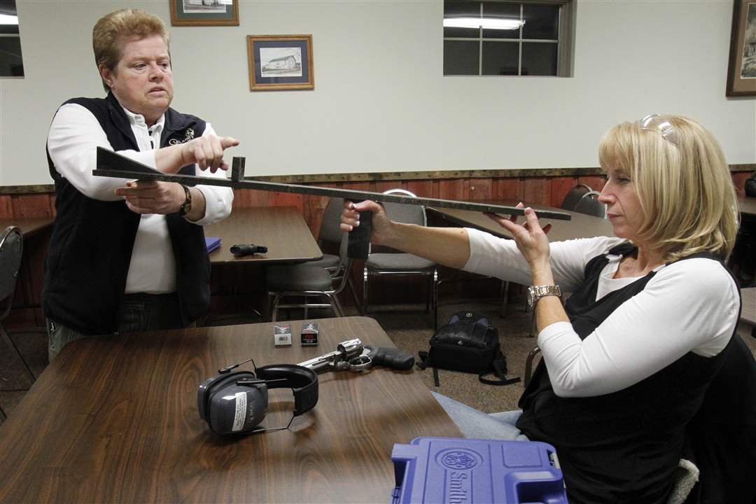 women-firearms-Theresa-Cleland-Denise-Quinn-aiming