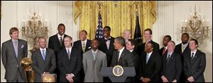 President Barack Obama honors the 2011 NBA basketball champions Dallas Mavericks during a ceremony in the East Room of the White House.