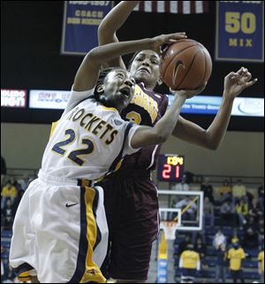 University of Toledo's Andola Dortch gets fouled by Central Michigan's Jessica Green in the last 1:03 of the game at Savage Arena.