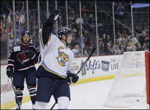 Walleye rookie Joey Martin raises his fist after scoring a goal against the Stingrays in the first period.