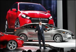 Dodge brand chief Reid Bigland introduces the 2013 Dodge Dart at the 2012 North American International Auto Show in Detroit. The Dart gives Dodge its first compact sedan since the Neon.