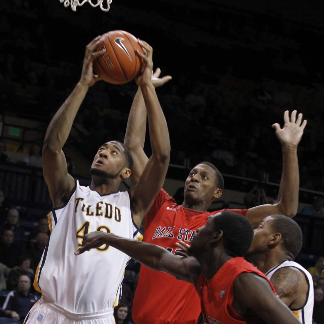 UT-s-Matt-Smith-grabs-a-rebound-with-Ball-State-s-Jarrod-Jones