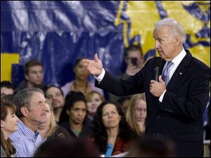 Vice President Joe Biden answers questions from the crowd during an event to discuss college affordability at Lincoln High School in Gahanna, Ohio. Biden talked about the high cost of a college education and the Obama administration's efforts to make it more affordable. 