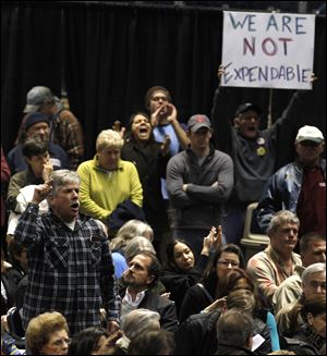 Youngstown citizens respond to speakers Wednesday during a community forum to discuss recent seismic activity related to deep wastewater injection wells.