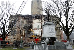 The interior of the Seneca County Courthouse stands exposed to the elements as a light rain falls on the third day of demolition.