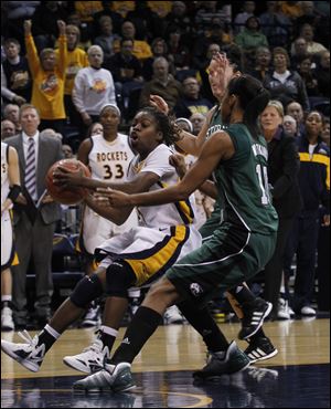 Toledo's Janelle Reed-Lewis is guarded by Eastern Michigan's Desyree Thomas in the Eagles' 70-66 win, dropping UT to 8-7 overall.