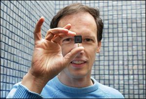 Jim McKelvey of the Third Degree Glass Factory shows off the Square, a new electronic-payment system developed by Twitter founder Jack Dorsey. The two-year-old firm has shipped more than 800,000 card readers and is now processing $2 billion in payments annually.