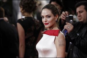 Angelina Jolie arrives on the red carpet at the Golden Globes.