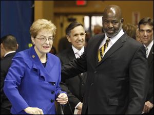 From left, Rep. Marcy Kaptur, Rep. Dennis Kucinich, and Toledo Mayor Mike Bell attend a Martin Luther King, Jr., unity celebration in Savage Arena at UT. Miss Kaptur and Mr. Kucinich face each other and Graham Veysey in a 9th Congressional District Democratic primary.