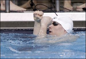 St. Francis senior Dan DiSalle celebrates a relay victory last year at the district. At the state meet, he was part of two championship relay teams.