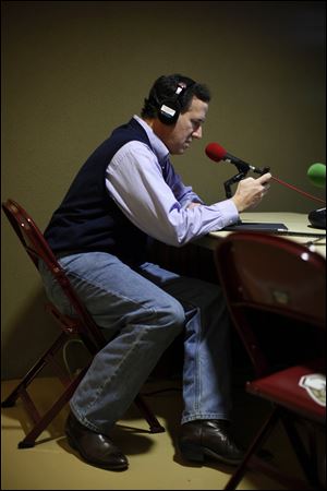 Republican presidential candidate Rick Santorum participates in a radio interview Friday at the Southern Republican Leadership Conference in Charleston, S.C.