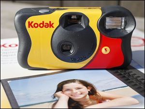 A Kodak FunSaver single use camera with Kodak inkjet paper.