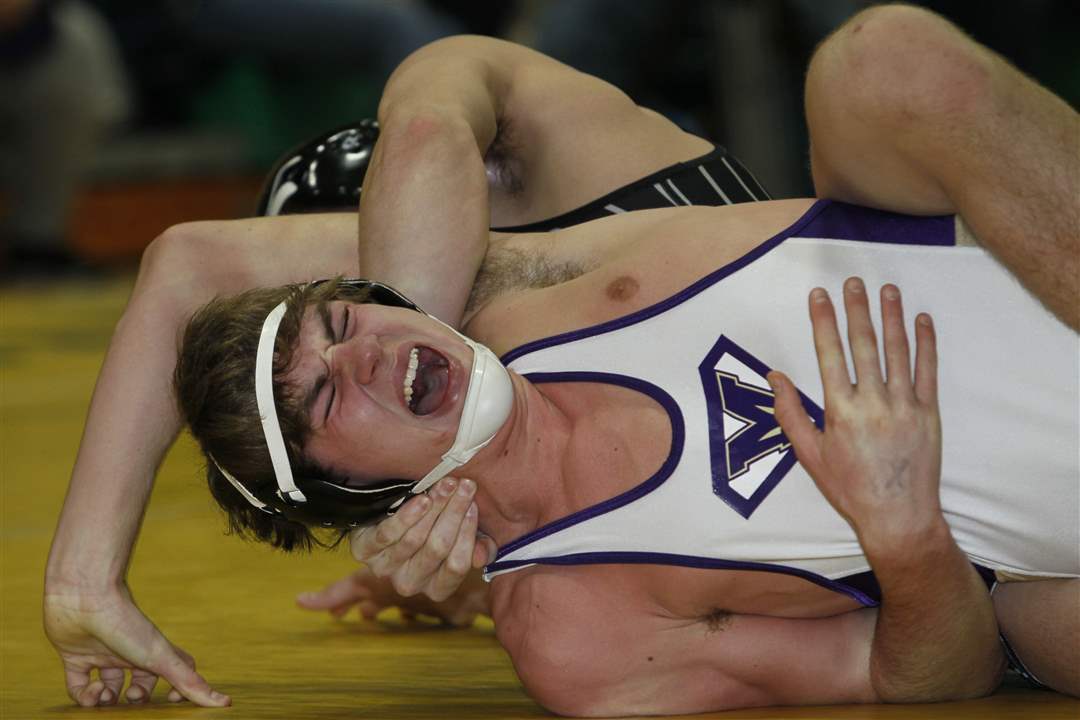 Maumee-wrestler-Rocco-Caywood-is-turned-by-Vince-PIckett-of-Central-Crossing