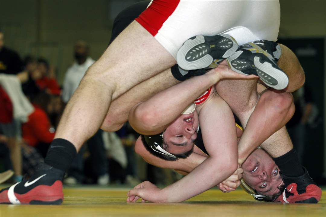 Wauseon-wrestler-Zane-Krall-left-tries-to-shake-off-Jared-Gray-of-Oregon-Clay