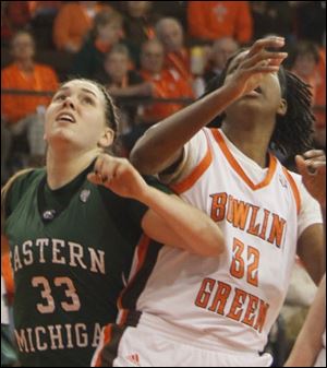 Olivia Fouty, a Northview graduate, battles for position with Alexis Rogers. Fouty finished with four points and two rebounds for Eastern Michigan Sunday afternoon.