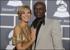 Heidi Klum, left, and Seal arrive at the 53rd annual Grammy Awards in Los Angeles.