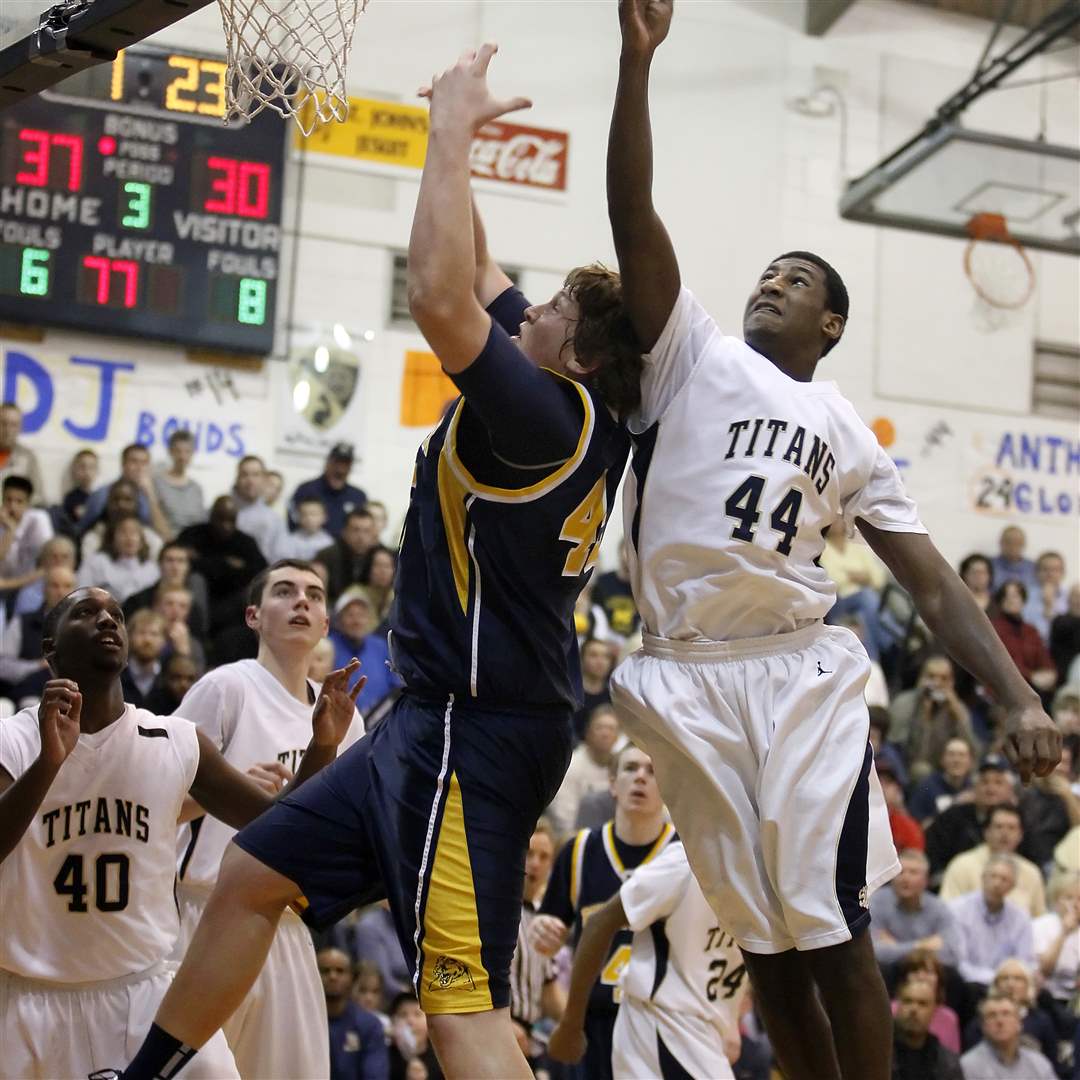 St-John-s-Caleb-Wallace-fights-for-a-rebound-with-Whitmer-s-Storm-Norton