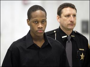 Michael Taylor III arrives at  Lucas County Common Pleas Court in Toledo.  He is charged with murder for the shooting death of Darrin Smith in April 2010.