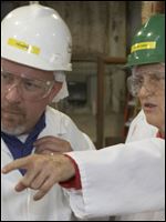 Temple Grandin, right, professor of animal science at Colorado State University, and Ronald S. Browning, assistant pork procurement manager at Hormel Foods Austin (Minn.) Plant, discuss features of the hog holding facility in 2010.