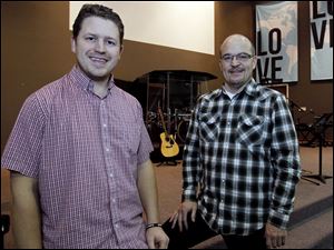 Tim Rabara, left, pauses with the Rev. Nate Elarton, lead pastor, at the church in Temperance. Mr. Rabara is pastor of the new campus and Mr. Elarton will tape the sermons to be delivered there.