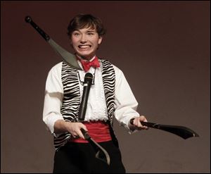 Toledo magician Eli Portala, 15, juggles machetes. His free magic show is to be performed Sunday at noon, 1:30, and 3:30 p.m.