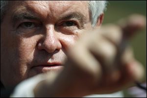 Republican presidential candidate and former House Speaker Newt Gingrich gestures as he campaigns Saturdayat The PGA Center for Golf Learning and Performance in Port St. Lucie, Fla. 