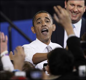 President Obama greets the crowds at UM, where he received big applause for calling for keeping tuition down. He proposed a 'Race to the Top' program similar to his K-12 initiative, in which states would compete for awards based on how well they use federal dollars.