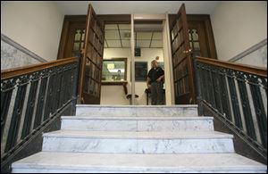 A marble staircase leads from the front entrance to the main floor, an insurmountable obstacle for a person in a wheelchair.