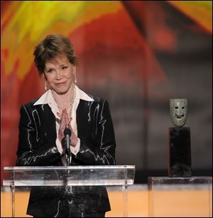 Mary Tyler Moore accepts the Life Achievement award at the 18th Annual Screen Actors Guild Awards on Sunday Jan. 29, 2012 in Los Angeles.