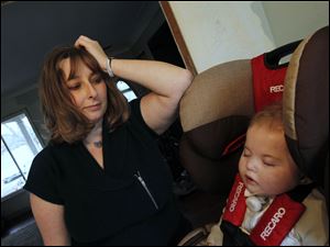 Crystal Tenney watches her son Caysen sleep after coming home from C.S. Mott Children's Hospital. Caysen has spent nearly his entire life in hospitals because of a condition with his esophagus.