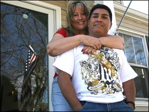 Jeanne, left, and Abelino Ruiz have been unable to fi nd jobs and are facing preforeclosure on their West Toledo home, like many of their neighbors. Mr. Ruiz lost his job as a factory worker last fall.