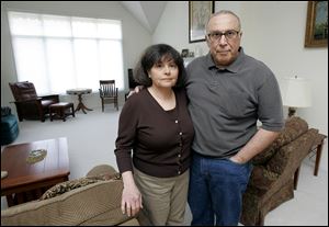 Rose and Al Geha, in their Waterville home, retired in 2007. Today, they volunteer with Mobile Meals and contribute to a weekly food collection. Mr. Geha offers tax preparation services.