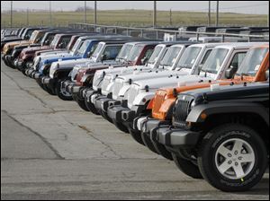 Toledo-built Jeep Wranglers -- lined up in the lot at Chrysler's North Assembly plant in North Toledo -- gained 23 percent from last January, with sales of 7,896. The Jeep Liberty was another big performer.