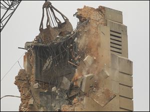 Crews take down the the clock tower of the Seneca County Courthouse.