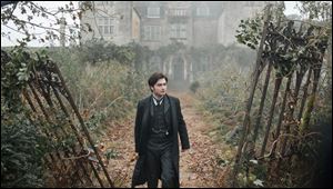 Daniel Radcliffe is a gloomy widower named Aruthur Kipps in the horror film, 'The Woman in Black,' which opens Friday.