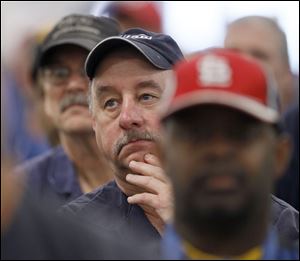 Workers in Belvidere, Ill., listen as Chrysler Chief Executive Officer Sergio Marchionne reveals plans to add 1,800 employees there. 'You are the new Chrysler,' he said. 