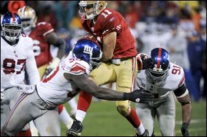 The Giants' Jason Pierre-Paul, left, has combined with fellow ends Osi Umenyiora and Justin Tuck have combined for 30  1/2 sacks this season.