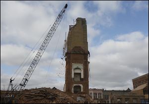 seneca crane clock tower A crane demolishes the clock tower of the Seneca County Courthouse Thursday, Feb. 2.
