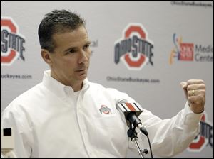 Ohio State football coach Urban Meyer answers questions from reporters during an NCAA college football national signing day event on  Feb. 1.