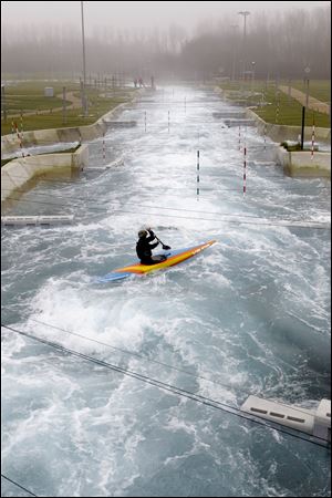 A canoeist paddles down the white water course at the Lee Valley White Water Center in north London. The white water course will host the London 2012 Olympic canoe slalom competitions. The center is open to public for white water rafting until April and after the Olympics. 
