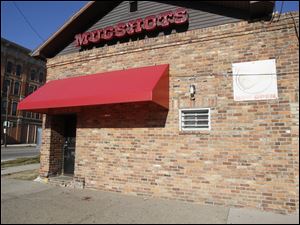 Three men and three women were injured in a shooting outside Mugshots bar in North Toledo early Monday.