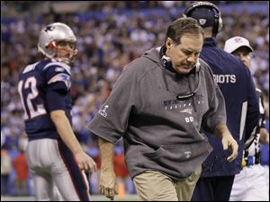Bill Belichick returns to the sidelines after talking with Tom Brady in the final minutes of Sunday's Super Bowl. The Patriots had a shot to run down the clock, but Brady threw two incompletions.