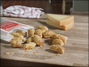 The new Parmesan bread bites are available at Domino’s nearly 5,000 U.S. locations, sold as a $1 add-on to a special offer on two pizzas.