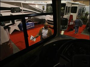 Visitors check out the recreational vehicles on display at the Camp & Travel Family RV Show.