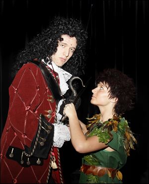 Senior Trevor Sharp as Captain Hook confronts Peter Pan, played by junior Emily Farnan. Both say their characters are unlike their real-life personalities. 