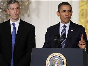 President Barack Obama, accompanied by Education Secretary Arne Duncan speaks about No Child Left Behind in the East Room of  the White House in Washington.