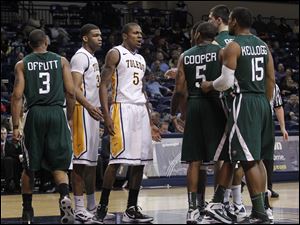 The Rockets' Rian Pearson (5) stands his ground as tensions rose during Wednesday's UT-Ohio game at Savage Arena.