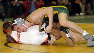 Clay's Mike Screptock works to turn Ivan McClay of Massillon Washington in the 126-pound final at the Maumee Bay Classic. Screptock won the title and is 33-4 this season after finishing fourth at the state tournament last year. Screptock and Garrett Gray recently topped 100 victories in their careers.