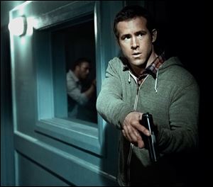 Ryan Reynolds plays rookie CIA handler Matt Weston, charged with bringing Frost in.